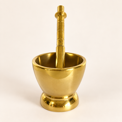 Mortar and pestle with the pestle standing inside